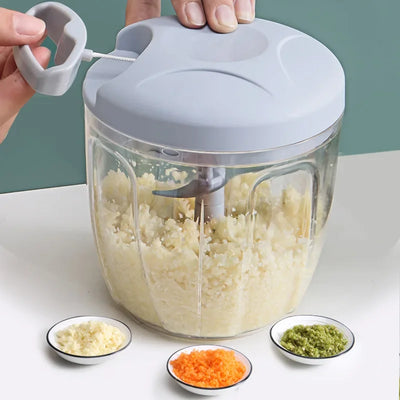 Manual garlic grinder with ABS material, featuring easy-to-use hand crank. Ideal for chopping vegetables, nuts, and herbs. Perfect kitchen gadget for efficient food preparation.